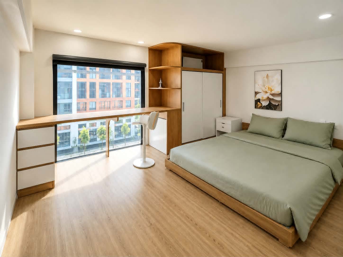 A403 — Khu ngủ ga xanh sage với tủ áo, kệ trang trí và bàn dài sát cửa sổ lớn
